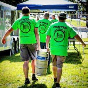 crafted beerfest volunteers carrying keg with jsquared tshirts