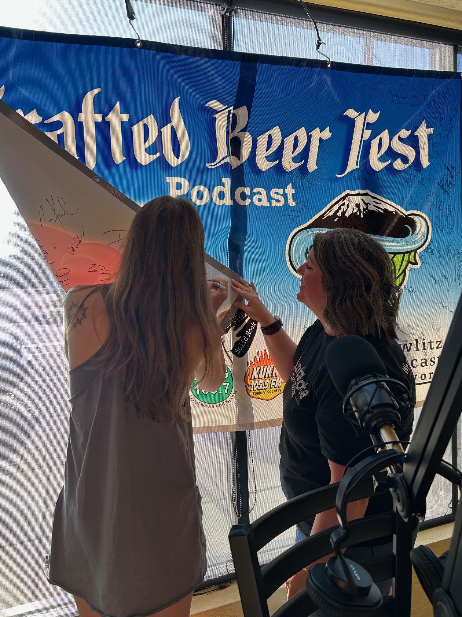 Emily Signing Crafted Podcast Banner